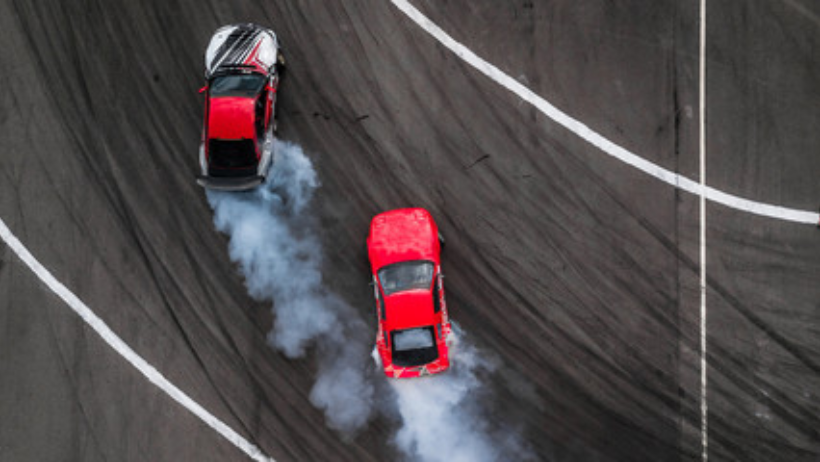 on a banked race track the smallest circular path on which cars